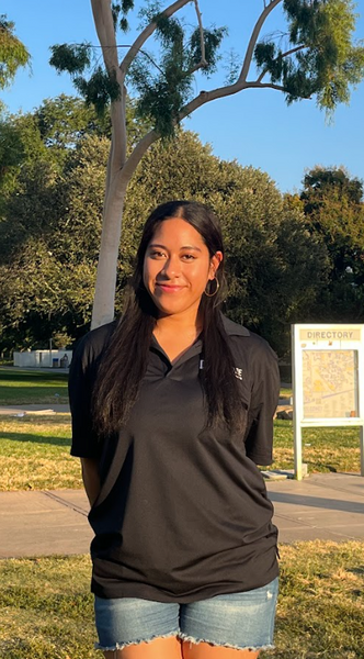 Fehi Lotoaniu smiling and wearing an APSP polo