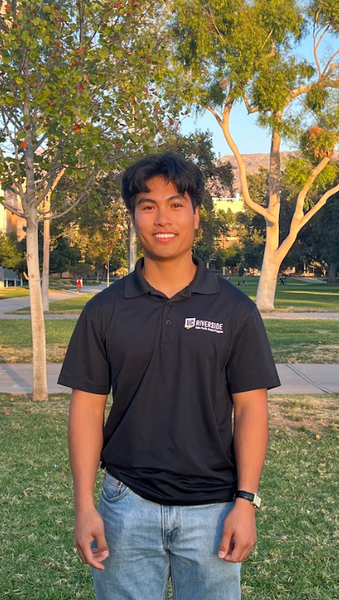 Jacob Pascasio smiling and wearing an APSP polo