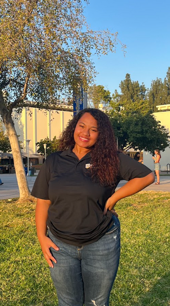 Tulu Tofavaha smiling and wearing an APSP polo